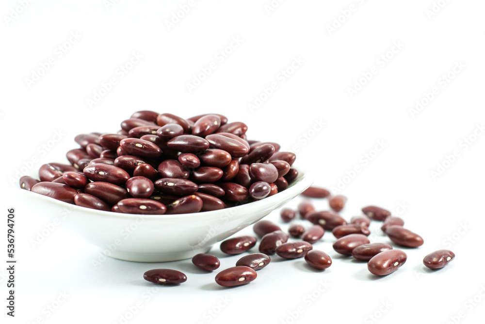 Red beans in a white ceramic bowl and placed on a white floor. Space for text. Red beans in a white ceramic bowl and placed on a white floor. Space for text.