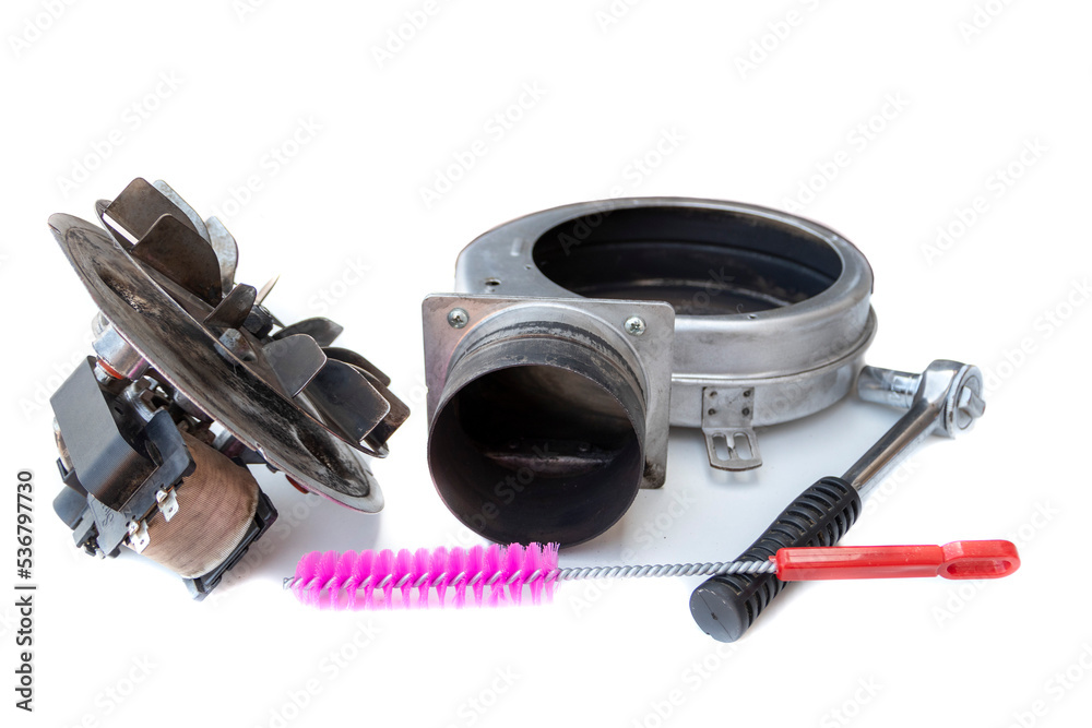 Smoke extractor motor, disassembled for cleaning, isolated on white background. Stove maintenance concept. Smoke extractor motor, disassembled for cleaning, isolated on white background. Stove maintenance concept.