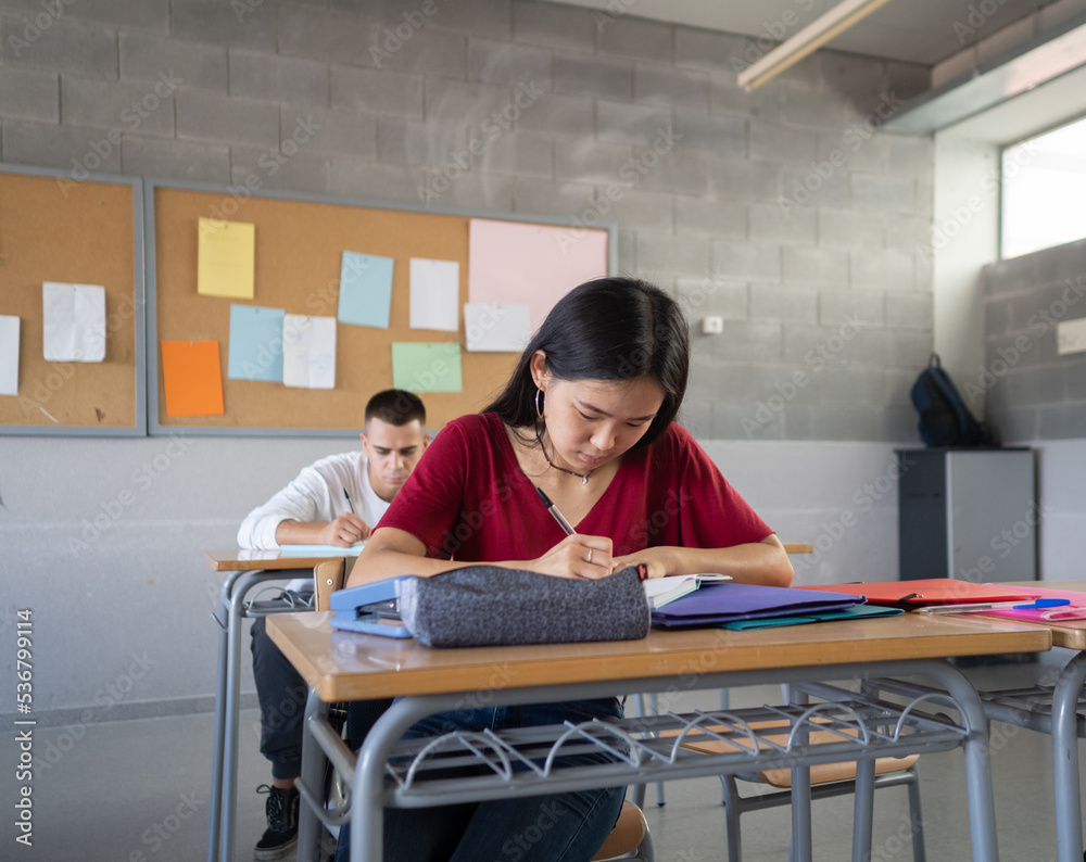 Students taking an exam at school .Education, high school Students taking an exam at school .Education, high school