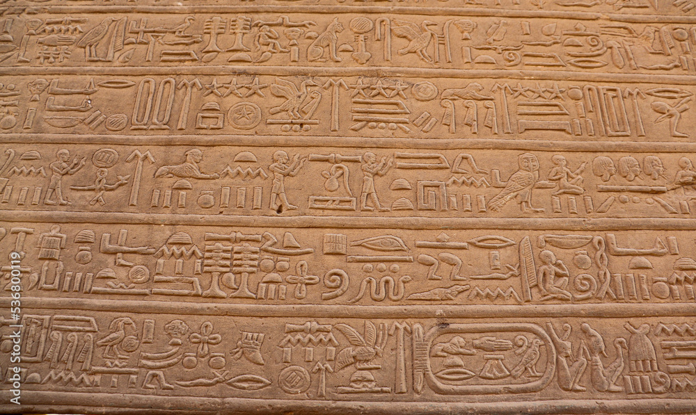 ancient egyptian hieroglyphics carved at Kom Ombo temple in Aswan, Egypt 