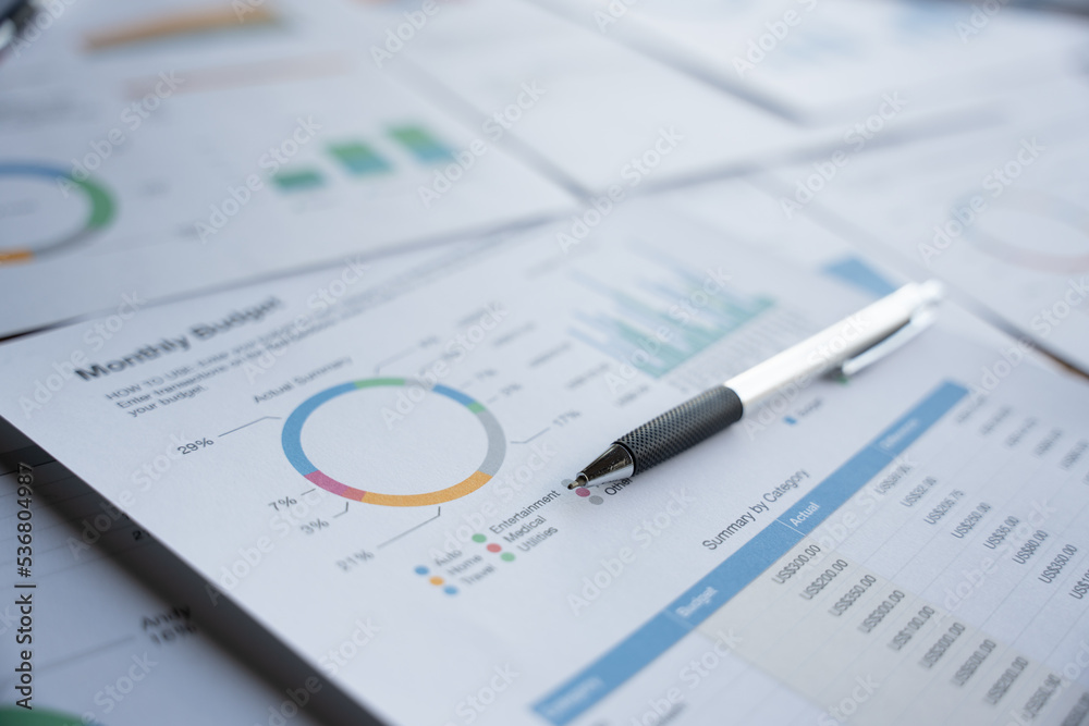 Analyzing investment charts, business paper, pen, Business office concept. Analyzing investment charts, business paper, pen, Business office concept.