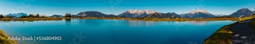 High resolution panorama with the famous Loferer and Leoganger Steinberge mountains in the background at Fieberbrunn, Tyrol, Austria photo