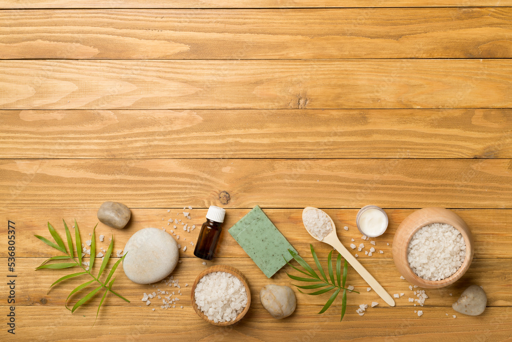 Composition with spa products on wooden background, top view