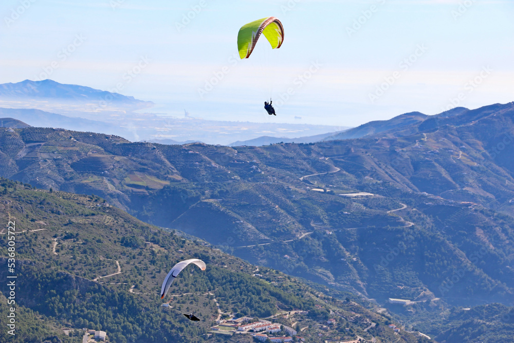 Paragliders in the Mountains of Andalucia in Spain Paragliders in the Mountains of Andalucia in Spain