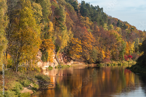 Landscape view of red sandstone caves on Gauja river in Sigulda  Latvia on a autumn day