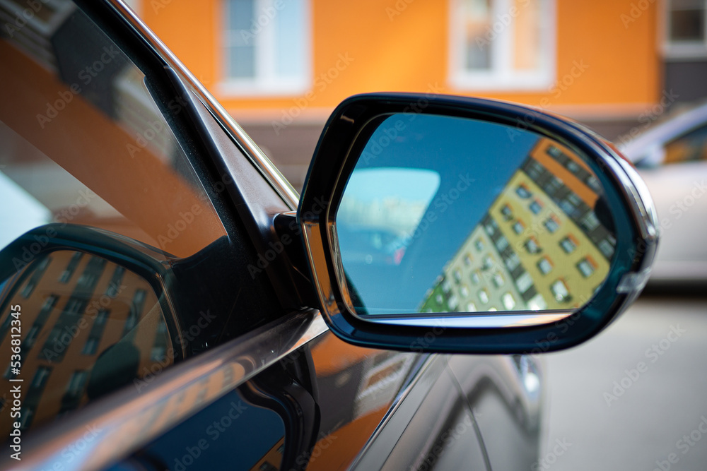 Anti-glare rearview mirror on a black car. Anti-glare rearview mirror on a black car.