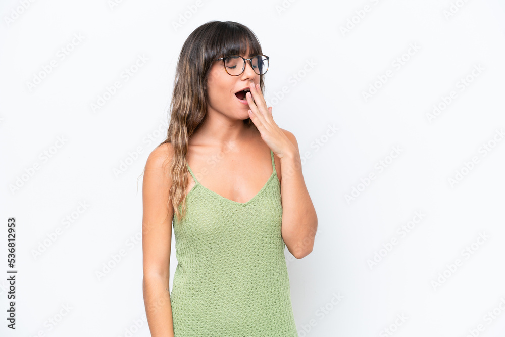 Young caucasian woman isolated on white background yawning and covering wide open mouth with hand Young caucasian woman isolated on white background yawning and covering wide open mouth with hand
