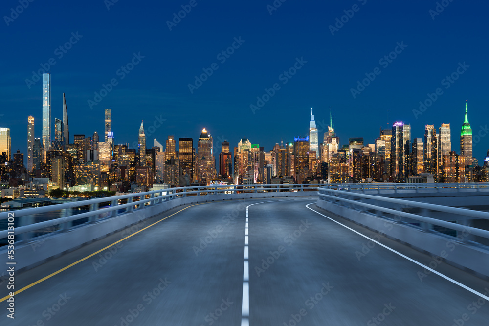 Empty urban asphalt road exterior with city buildings background. New modern highway concrete construction. Concept of way to success. Transportation logistic industry fast delivery. New York. USA.