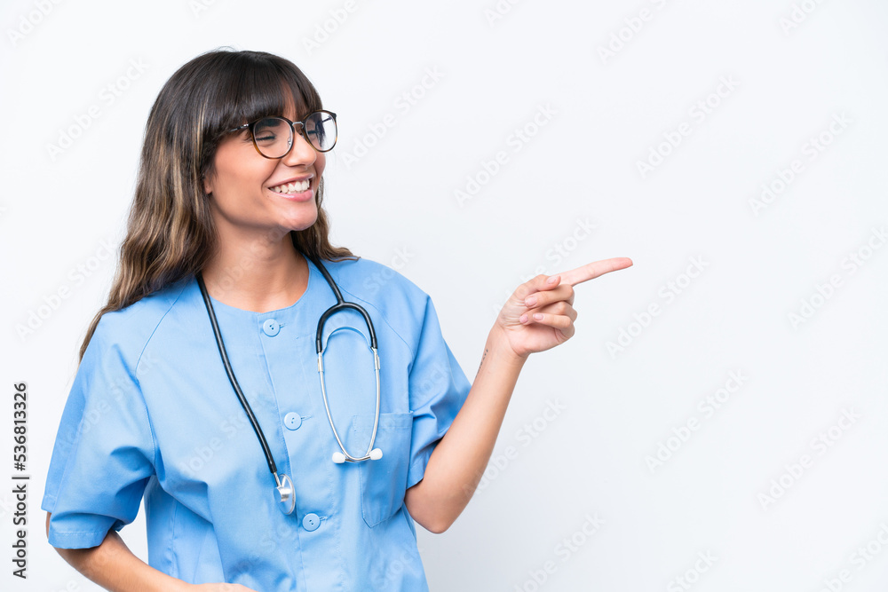 Young caucasian nurse woman isolated on white background pointing finger to the side and presenting a product Young caucasian nurse woman isolated on white background pointing finger to the side and presenting a product