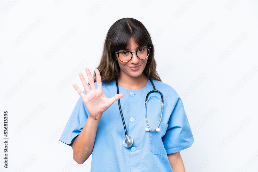 Young caucasian nurse woman isolated on white background counting five with fingers Young caucasian nurse woman isolated on white background counting five with fingers