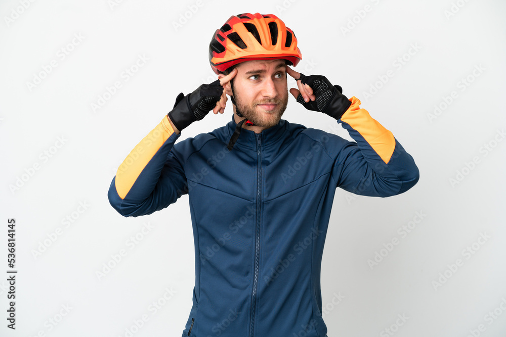 Young cyclist man isolated on white background having doubts and thinking Young cyclist man isolated on white background having doubts and thinking