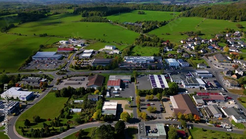 Aerial view of residential buildings and trees under the blue sky, Rennerod, Germany photo