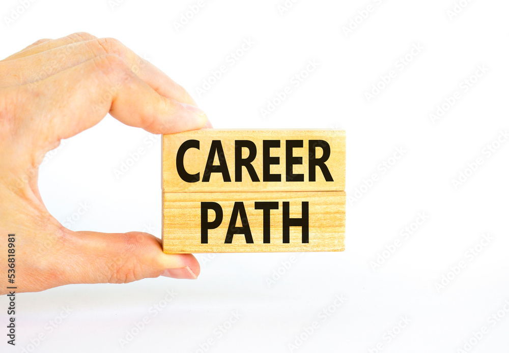 Career path symbol. Concept words Career path on wooden blocks on a beautiful white table white background. Businessman hand. Business Career path concept. Copy space. Career path symbol. Concept words Career path on wooden blocks on a beautiful white table white background. Businessman hand. Business Career path concept. Copy space.