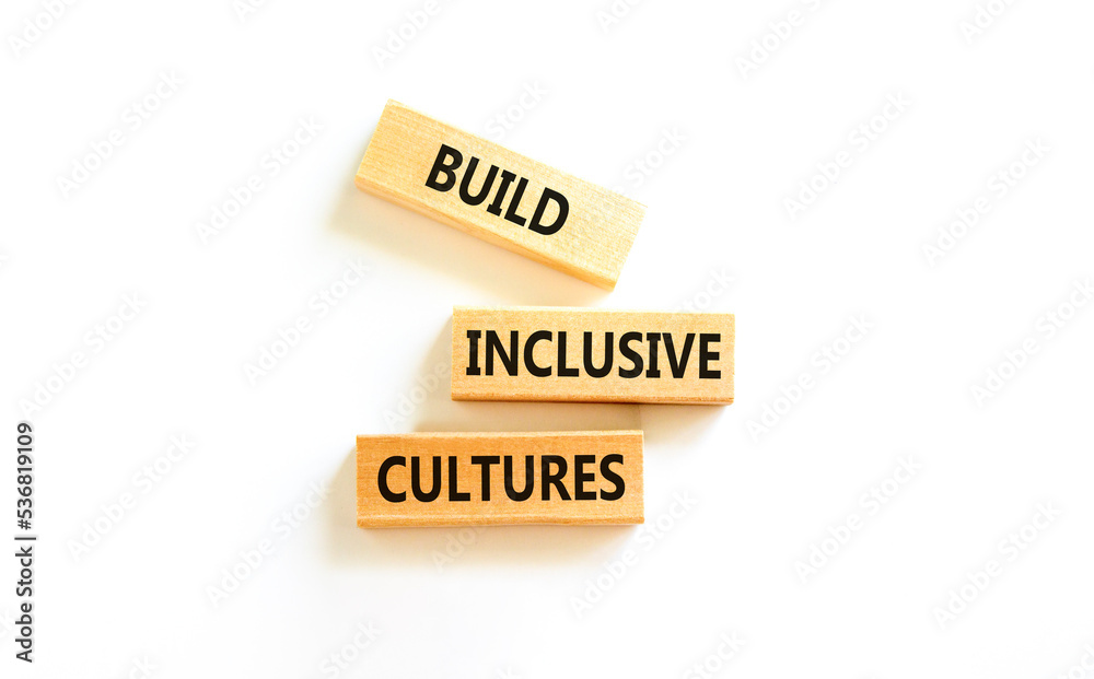 Build inclusive cultures symbol. Concept words Build inclusive cultures on wooden blocks. Beautiful white table white background. Business build inclusive cultures concept. Copy space. Build inclusive cultures symbol. Concept words Build inclusive cultures on wooden blocks. Beautiful white table white background. Business build inclusive cultures concept. Copy space.