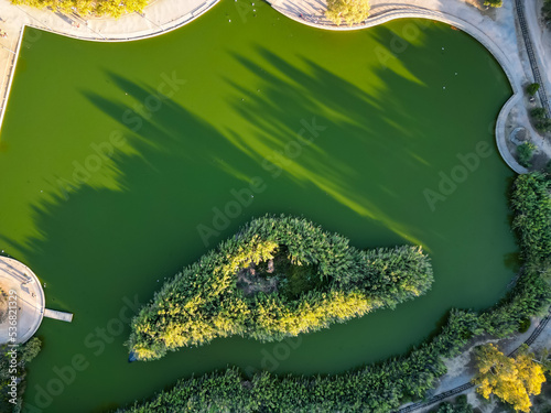 Aerial photo of the lake at the Tritsi Park in Agioi Anargiroi area of Athens, Greece photo