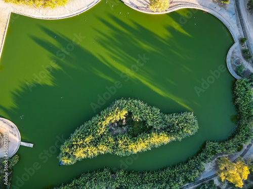 Aerial photo of the lake at the Tritsi Park in Agioi Anargiroi area of Athens, Greece photo