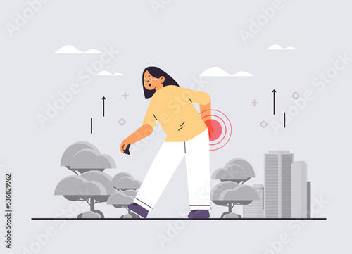 businesswoman suffering from back pain inflammation of muscles painful inflamed area highlighted in red disease symptoms