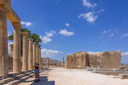 Panoramic view of ruins of ancient city of Lindos on colorful island of Rhodes, Greece. Famous tourist attraction. Ancient temple Greek architecture. High quality photo