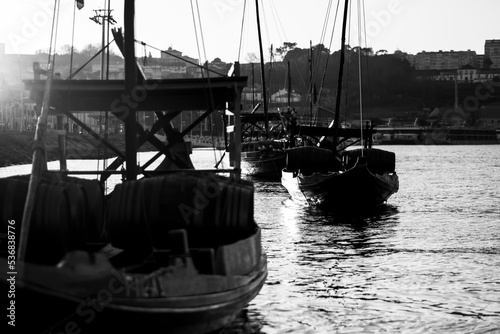 Vintage Traditional Boats in Vila Nova de Gaia, Porto, Portugal. Black and white photo.