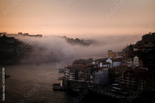 Fog over the Douro River, in the twilight light, Porto, Portugal..