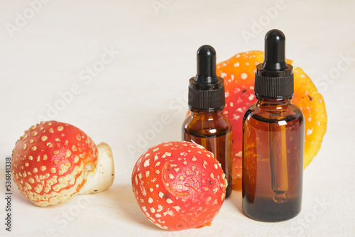 fly agaric red and glass amber dropper bottles photo