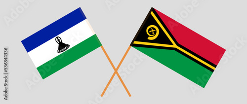 Crossed flags of Lesotho and Vanuatu. Official colors. Correct proportion