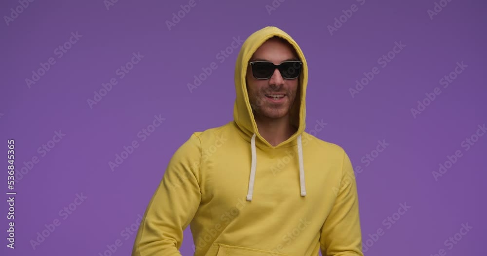 handsome casual man having a playful dance and inviting over handsome casual man having a playful dance and inviting over