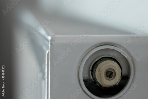 A close up of a white Heating radiator