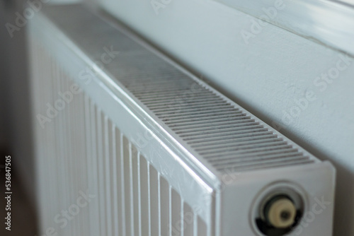A close up of a white Heating radiator