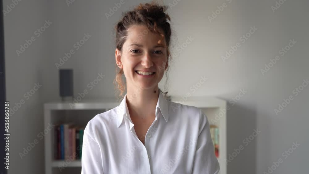 One young business woman caucasian female standing in the office and smiling modern business entrepreneur concept