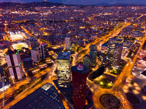 Aerial view of illuminated Plaza de Europa with modern conference center Fira Barcelona Gran Via photo