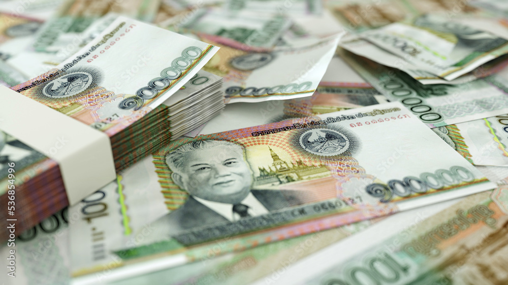 close up of Laotian kip notes spread on table. 3d rendering of money scattered on surface close up of Laotian kip notes spread on table. 3d rendering of money scattered on surface