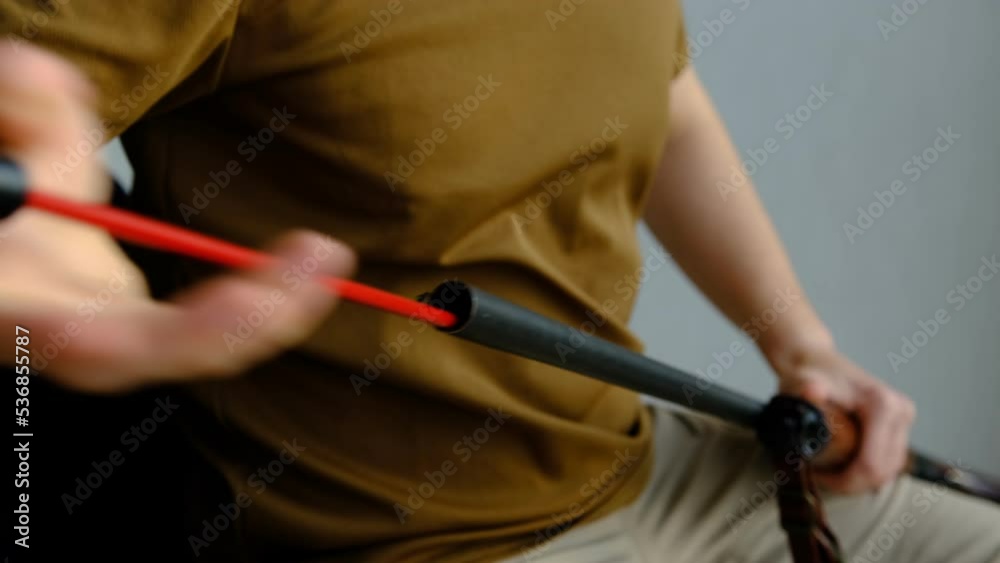 Close up of a gunsmith cleaning firearm barrel with ramrod brush. Close up of a gunsmith cleaning firearm barrel with ramrod brush.
