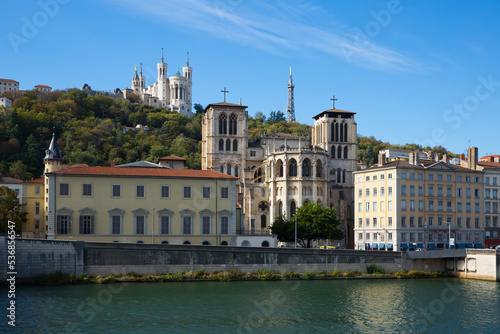 View of Cathedral of Saint-Jean and Notre Dame de Fourviere Basilica on hill on bank of river Saone in Lyon, France ..