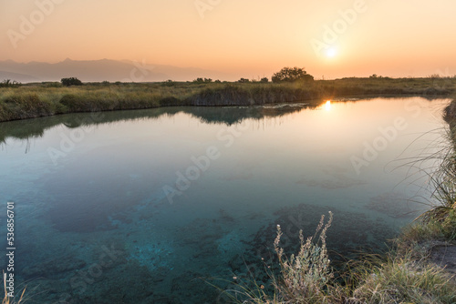 Pond blue in the sunrise  Cuatro Cienegas  Natural National Park in the state of Coahuila  Mexico - Pristine blue lake - Poza azul near of Gypsum dunes and the marble mine.