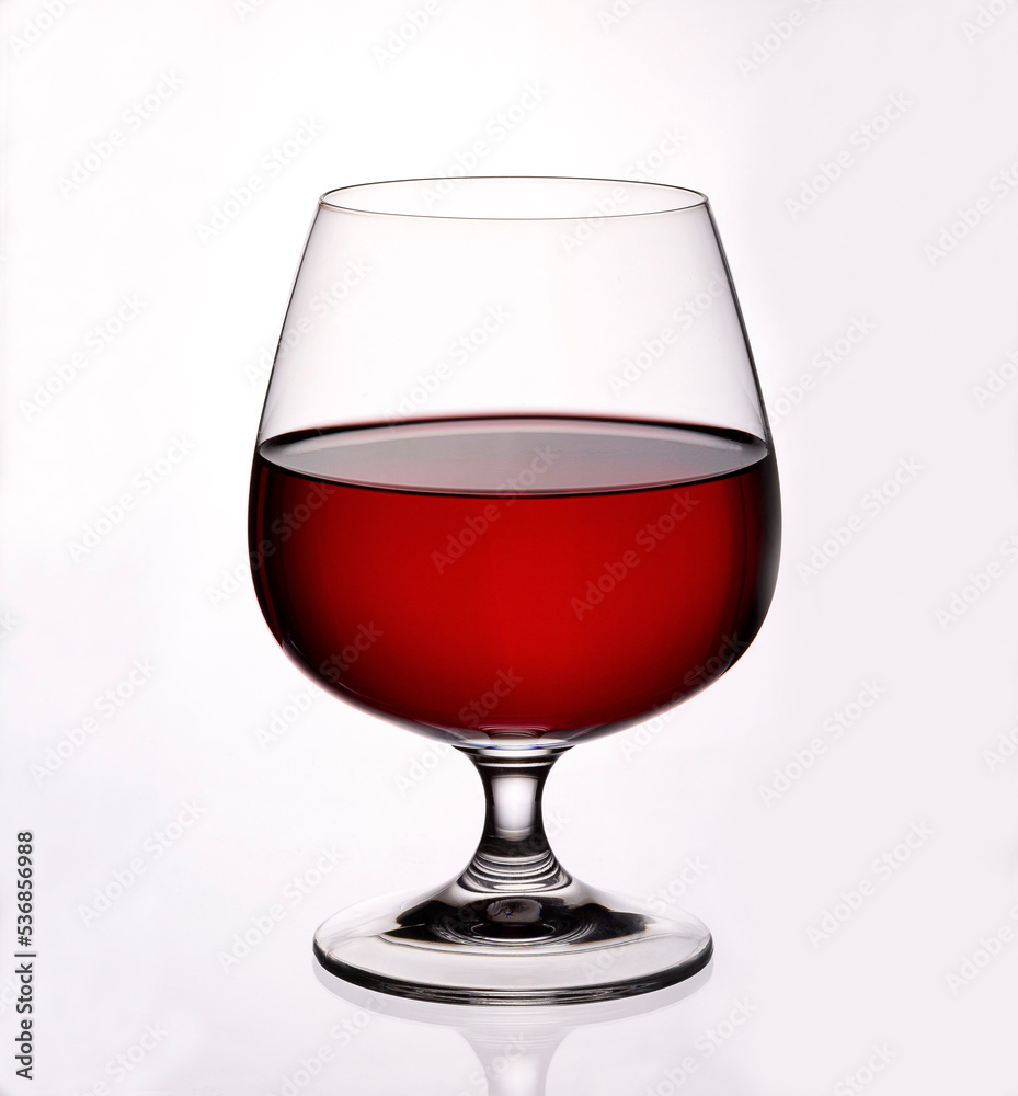 Glass goblet with red wine on white background Glass goblet with red wine on white background