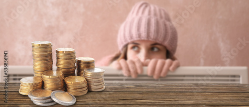 Wooden table with coins and...