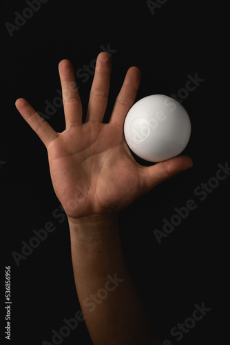 close up portrait of juggling balls, on black background