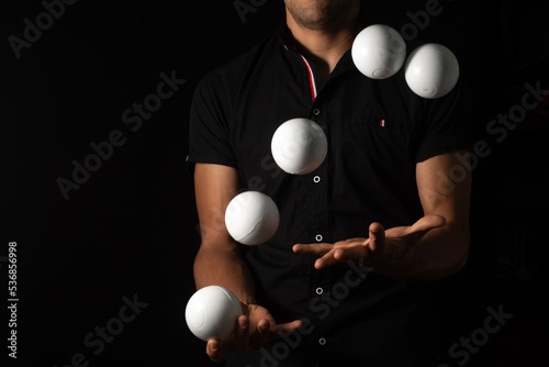 close up portrait of juggling balls, on black background