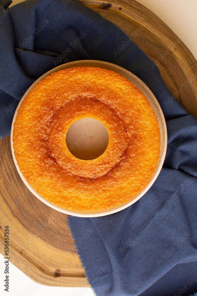 Brazilian Cornmeal Cake Bolo De Fuba Cut Brazilian Style On A White Plate Isolated On Jute