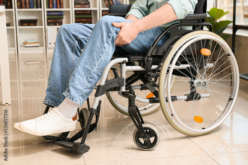 Young man in wheelchair at home