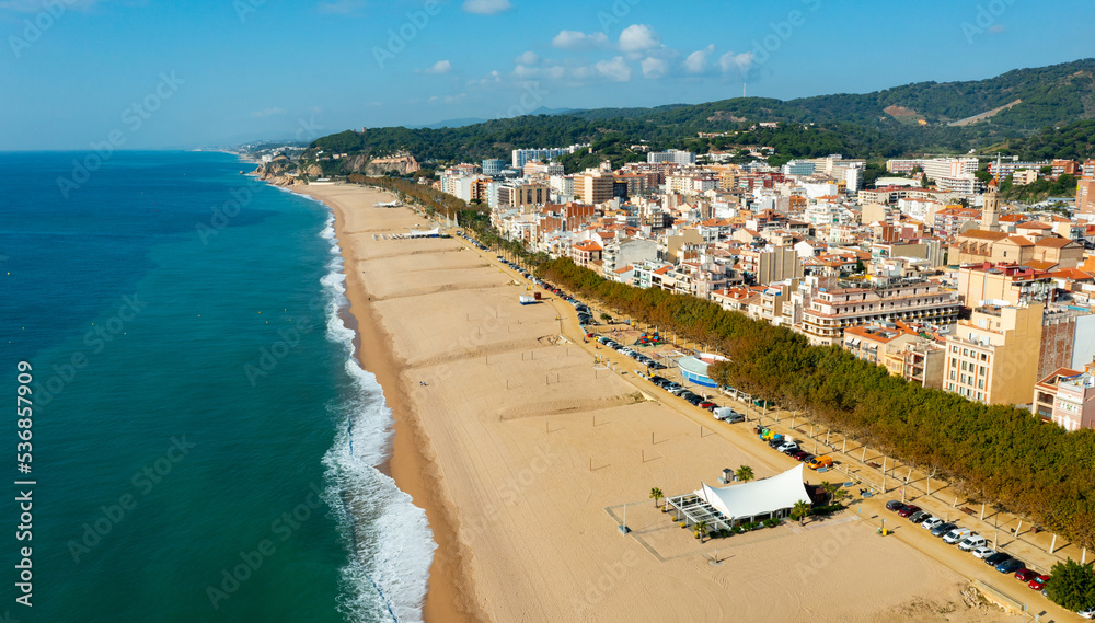 Aerial view from drone of Calella Beach on sunny autumn day in Catalonia, Spain