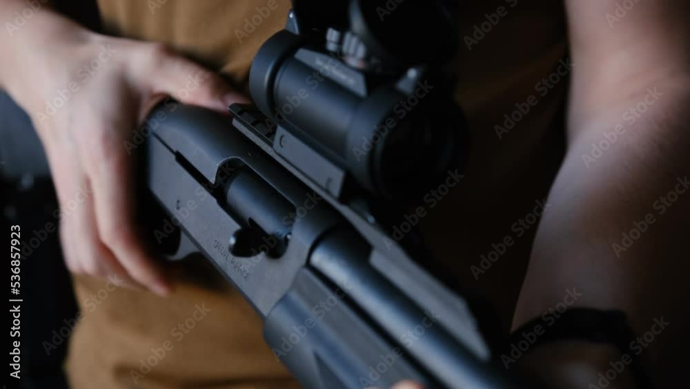 Close Up Of Inspecting Rifle And Loading The Weapon. Man checking the ...