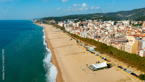 Aerial view from drone of Calella Beach on sunny autumn day in Catalonia, Spain