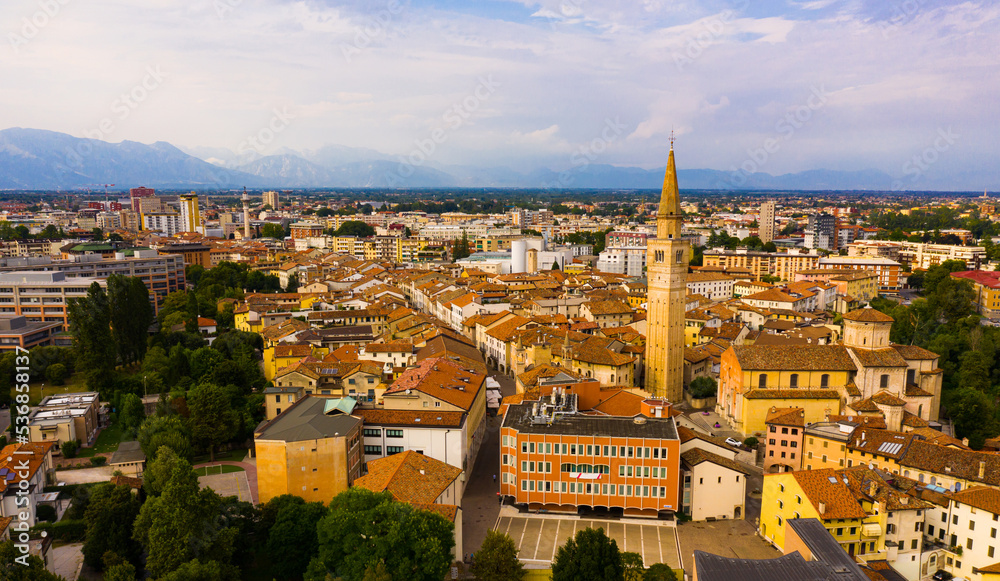 Scenic cityscape from drone of Italian town of Pordenone in sunny day, Italy