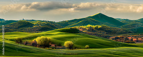 Beautiful and miraculous colors of green spring panorama landscape of Tuscany, Italy. Tuscany landscape with grain fields, cypress trees and houses on the hills at sunset. 