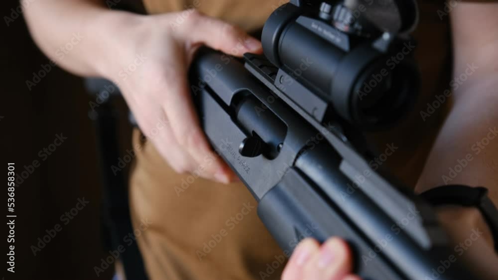 Close Up Of Inspecting Rifle And Loading The Weapon. Man checking the ...