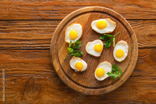 Fried quail eggs on wooden ...