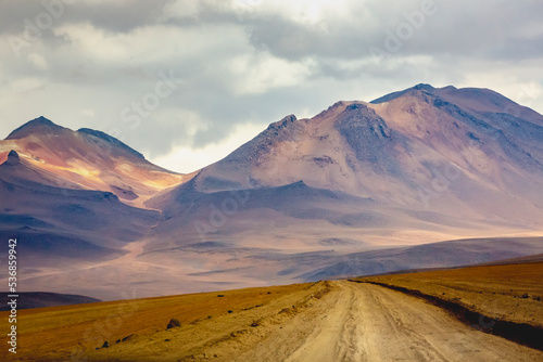 Dirt road in Atacama desert, volcanic arid landscape in Chile, South America © Aide