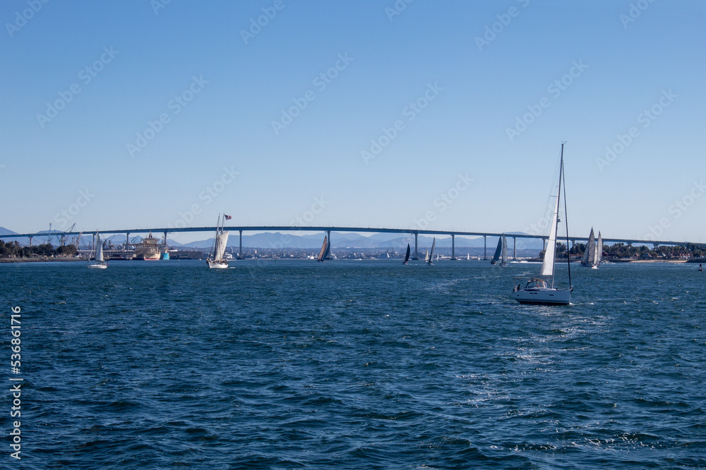 View of the iconic Coronado Bay Bridge and water activity around it. View of the iconic Coronado Bay Bridge and water activity around it.